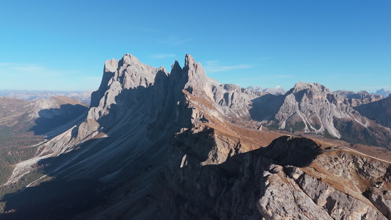 Dramatic Seceda ridgeline in Puez-Odle Nature Park in Dolomites. Autumn aerial