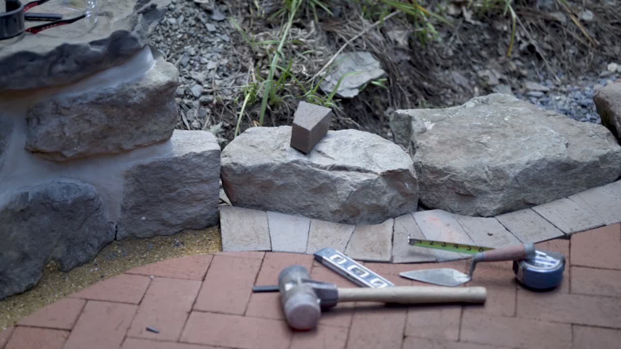 Building a Retaining Wall with Stones and Bricks