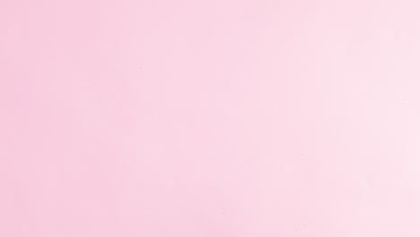 Slices of fresh fruits appear on top and bottom of pastel pink theme. Stop motion