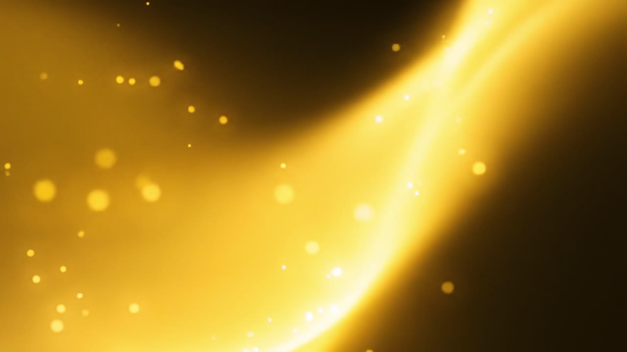 Lovely golden light flows through a dark space, creating beautiful patterns and shimmering effects. This captivating moment highlights the beauty of light in an artistic manner.