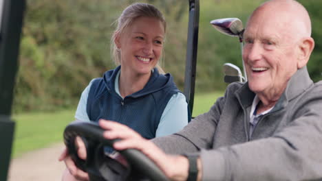 elderly man and young woman driving golf cart