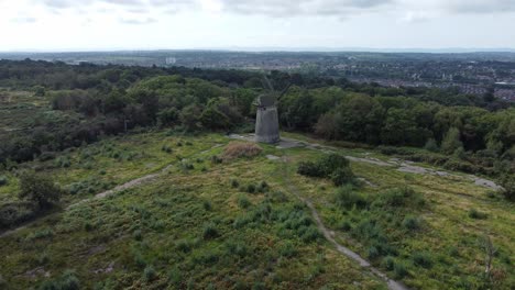 bidston hill disused rural flour mill restored traditional wooden sail windmill birkenhead aerial view descending push in