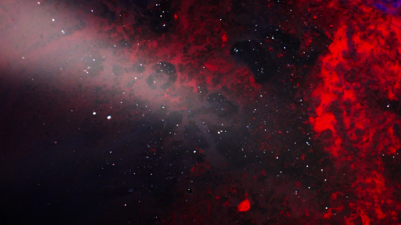 Abstract red and black ink forming space-like shapes in dreamy cosmic macro style