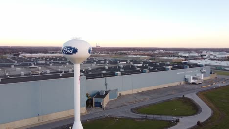 water tower in front of ford woodhaven stamping plant in wyandotte, michigan - aerial drone (orbiting)