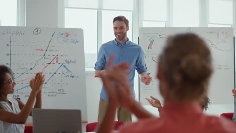 business people celebrating success in meeting room