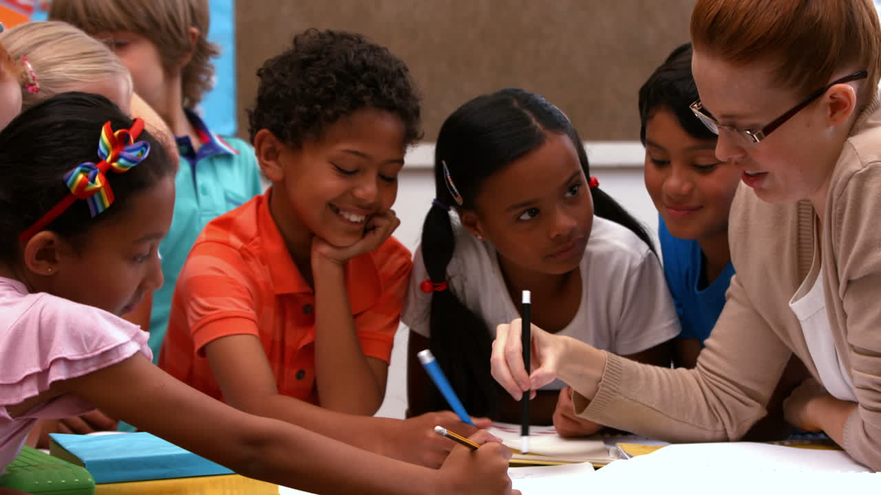 Teacher colouring with her pupils