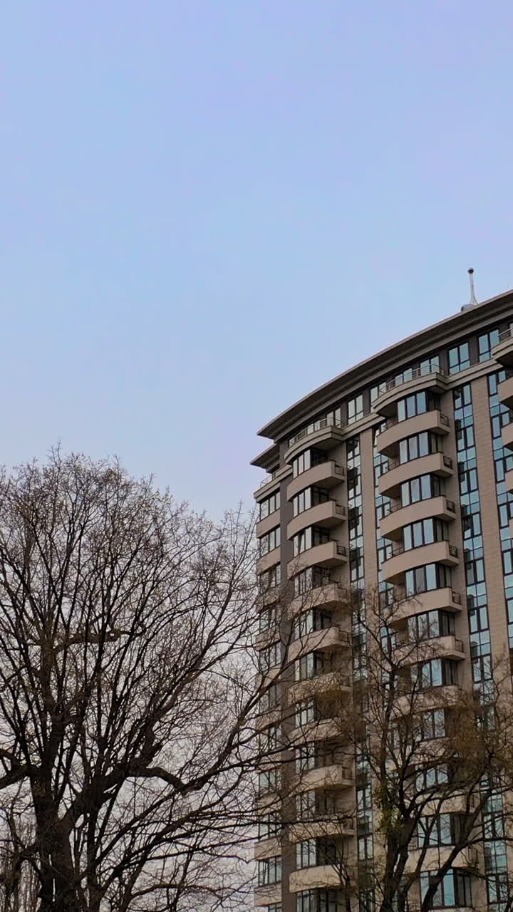 Image showcasing Luxury high rise apartment buildings. Aerial view of the exterior of ...