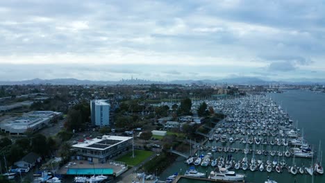 sail boats in their berths during a sunny cloudy day