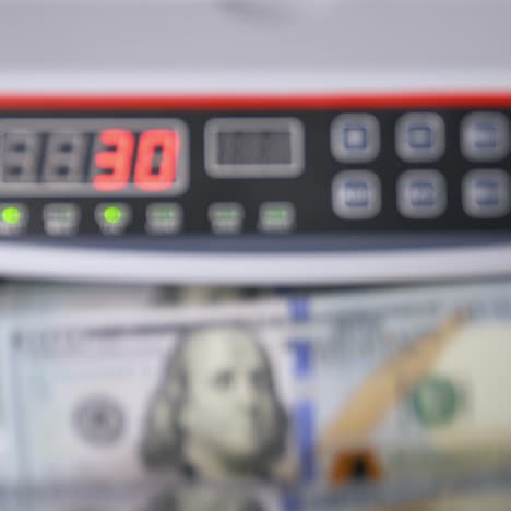 modern electronic bill counter with money, closeup