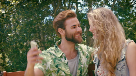 in high quality format young couple relaxing on park bench