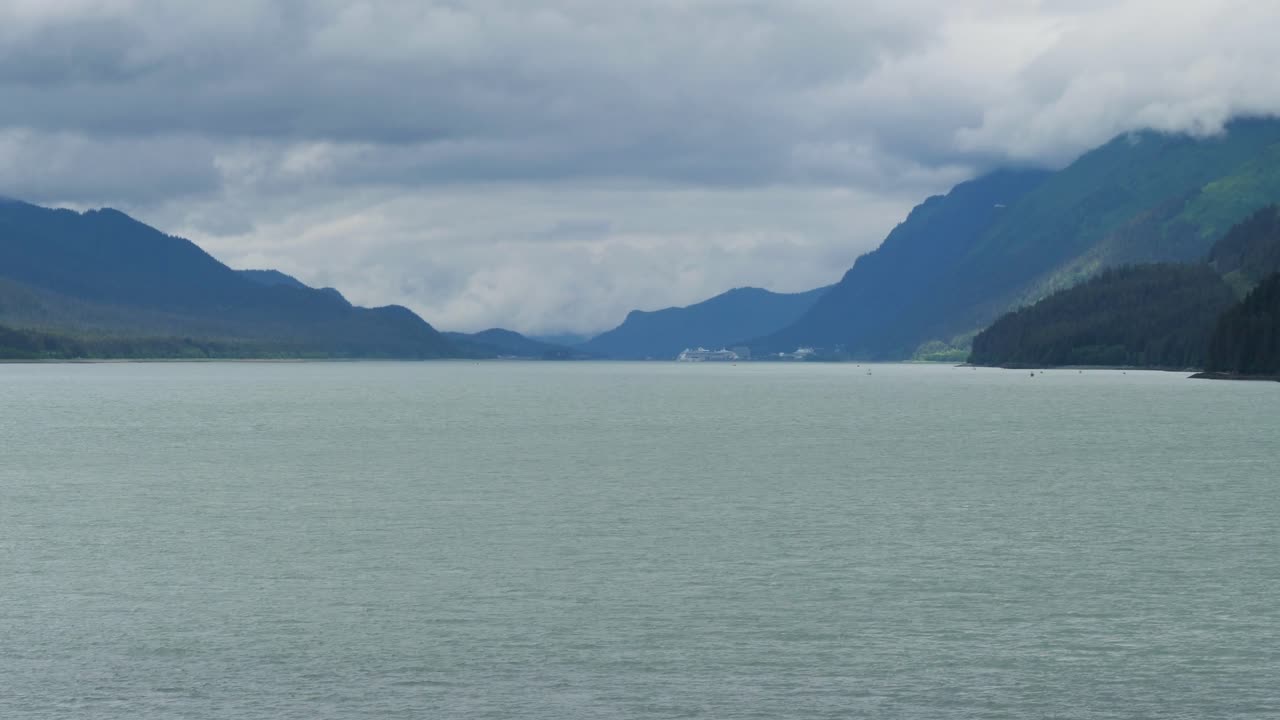 Sailing the Gastineau Channel on a cloudy and rainy day to Juneau.Beautiful Alaskan scenery.