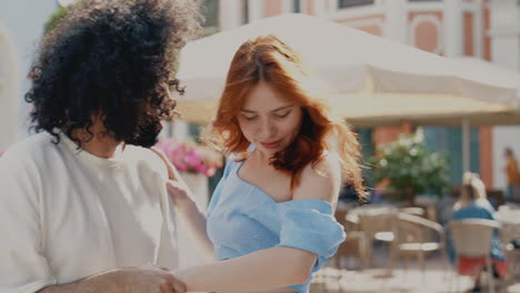 couple dancing and hugging in a city cafe