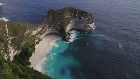 tyrannosaur t-rex cliff at kelingking beach, nusa penida, indonesia - aerial view