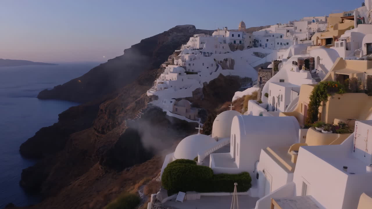 Santorini Sunset: White Villages Clinging to Cliffs Overlooking the Aegean Sea