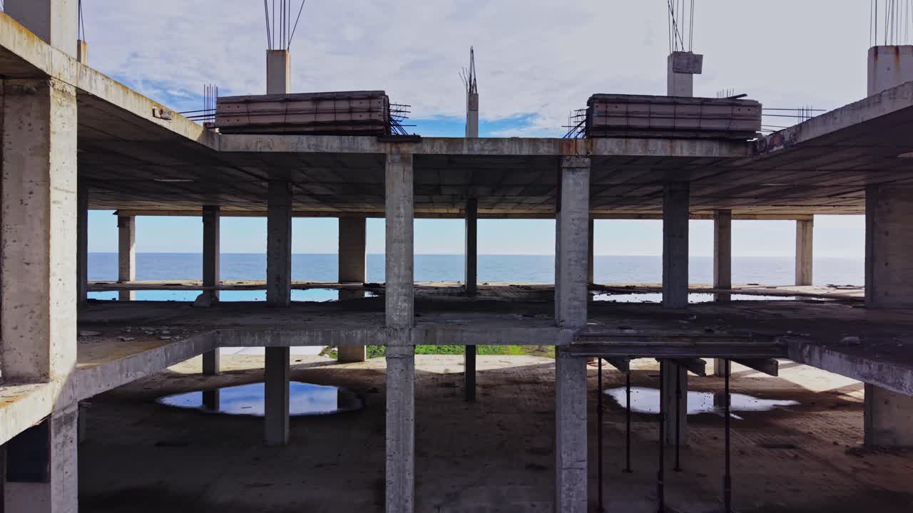 Ruins of an abandoned building overlooking the sea from above