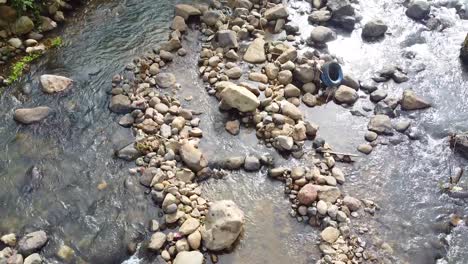 drone-shot-over-the-river-with-rocks