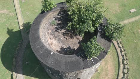mauritius - port louis -flyng hover with tilt down on round stone defence tower martello type