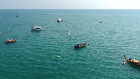 Aerial-view-of-boats-in-a-bay-in-Koh-Lanta,-Thailand