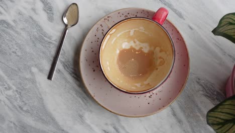 Top-view-of-empty-coffee-cup-on-table