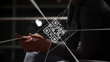 QR-code-scanner-and-network-of-connections-against-mid-section-of-person-using-smartphone