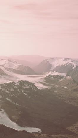 stunning view of snowy mountains with a pink sunset