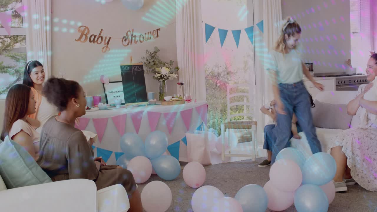 Women gathering at baby shower, woman grabbing marker, marking score on board, kneeling near baby