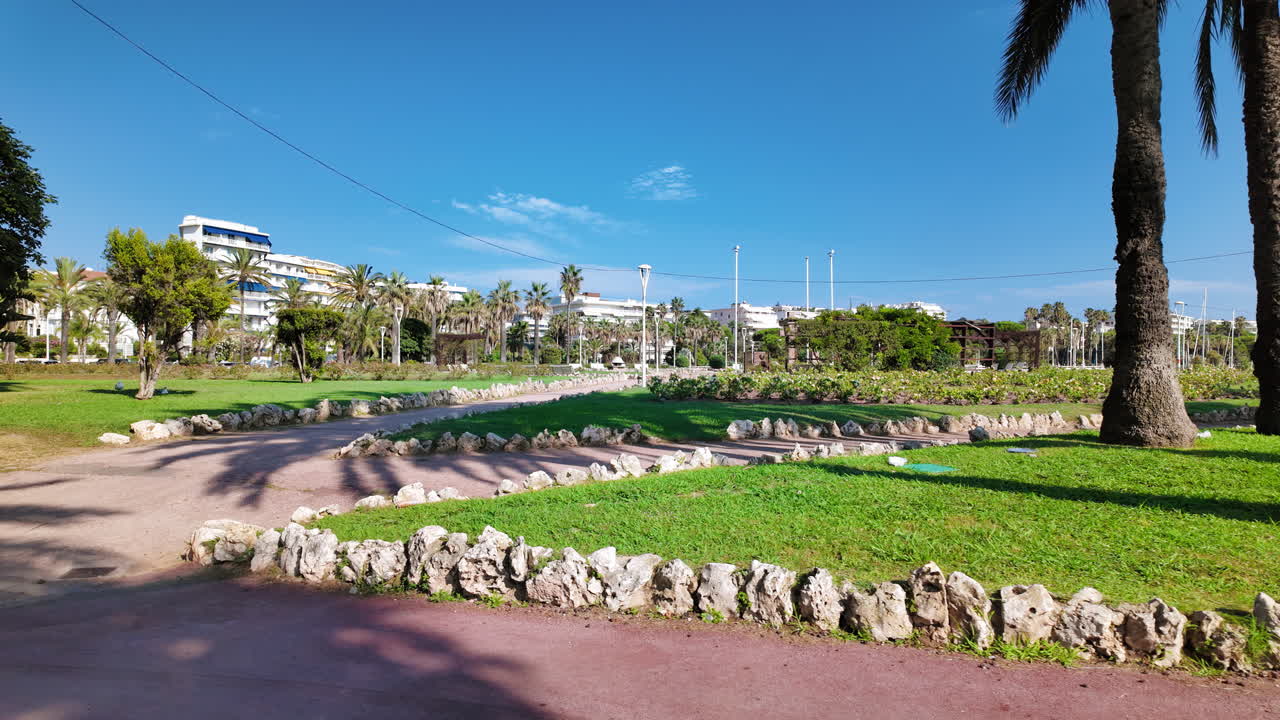 A walk through Square du 8 mai 1945 in Cannes, France in daylight