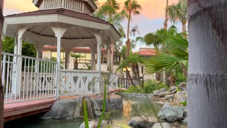 A-pergola-in-a-park-at-sunset---low-angle-reveal