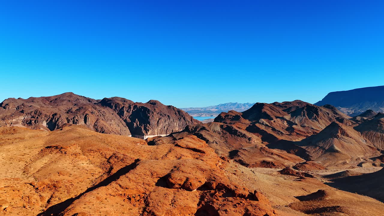 Vegetation less mountain landscape in the rays of bright sun. Wilderness of Arizona, USA from drone