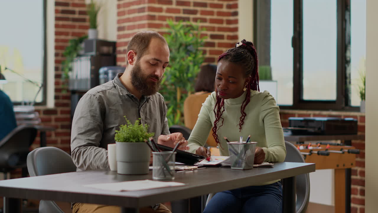 Diverse team of people planning business presentation with data charts