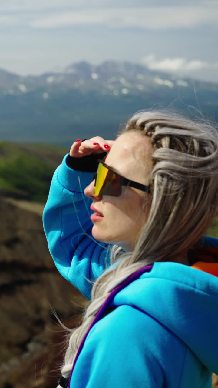 Young Woman with Dreadlocks Enjoying Scenic Mountain View