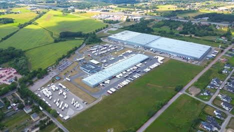 Aerial-view-of-warehouse-storages-or-industrial-factory-or-logistics-center-from-above