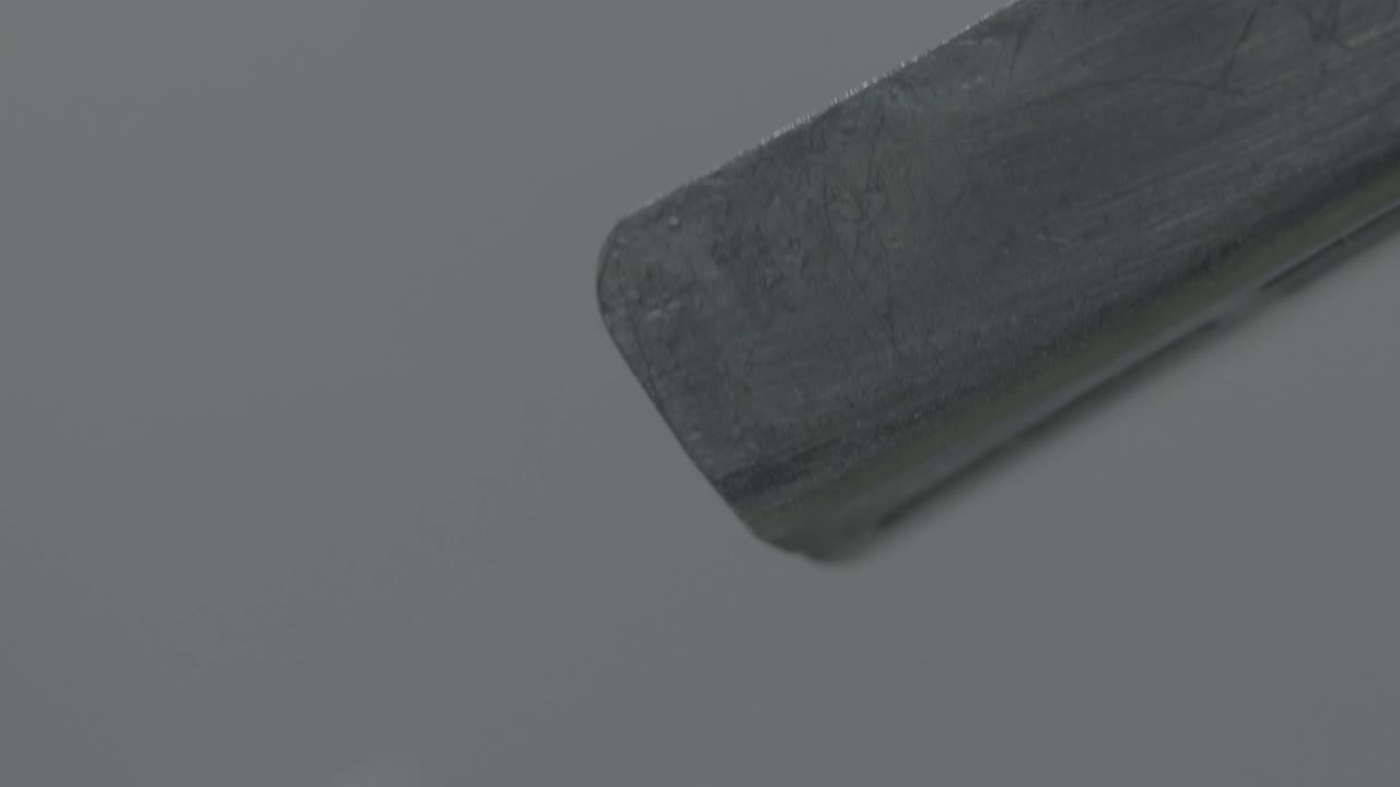 close view of pill manufacturing, rapidly moving along the assembly line.