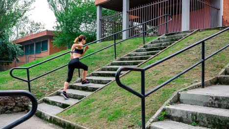 female athlete climbing stairs outdoors