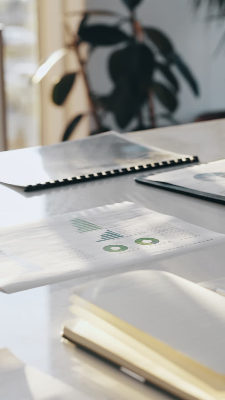 Business Documents and Charts on an Office Desk