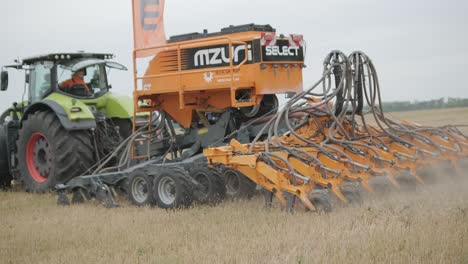 demonstration of agricultural machinery at an exhibition. tractors operate in the field, showcasing their capabilities and performance in action