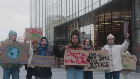 group of young activists with banners protesting against climate change in the city