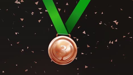 bronze medal with green ribbon and confetti