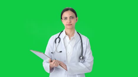 Sad-Indian-female-doctor-listening-to-patient-Green-screen