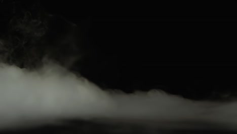 terrible mummy hand rising out from the smoke at black background. slow motion - terrible mummy hand rising out from the smoke at black background at dark studio. slow motion