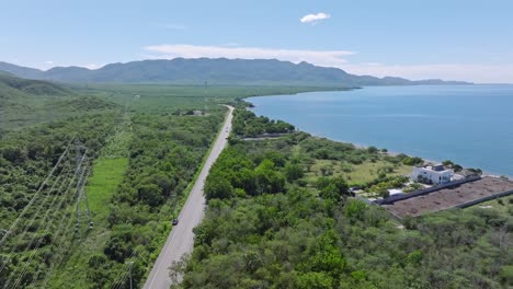 tranquil rural coastal street through vast rainforest on the dominican republic