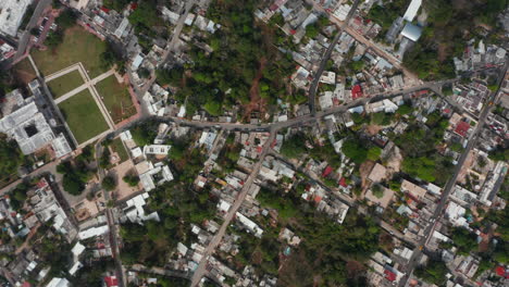 Aerial-birds-eye-overhead-top-down-view-of-town-development.-Houses-along-streets-from-height.-Valladolid,-Mexico