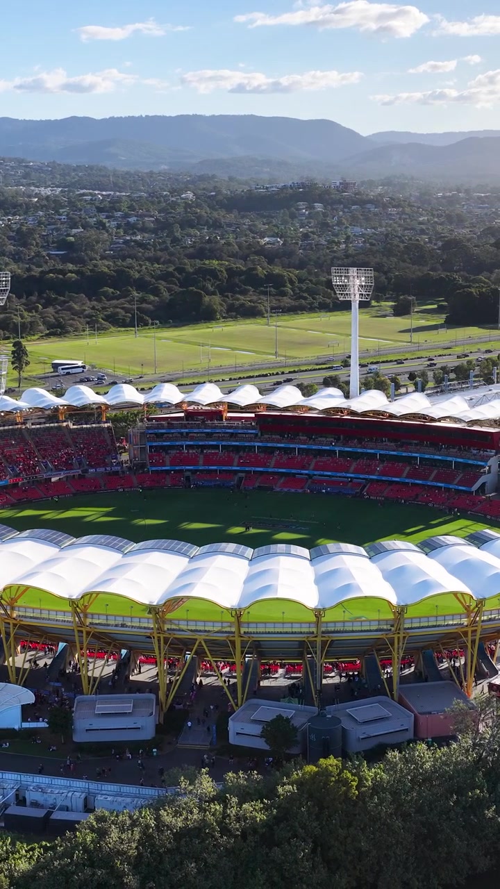 Aerial View of a Large Sports Stadium at Sunset
