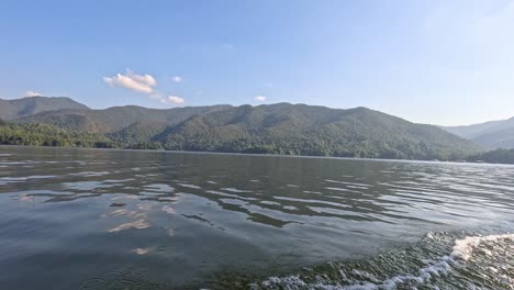 progression of a boat ride on a serene lake