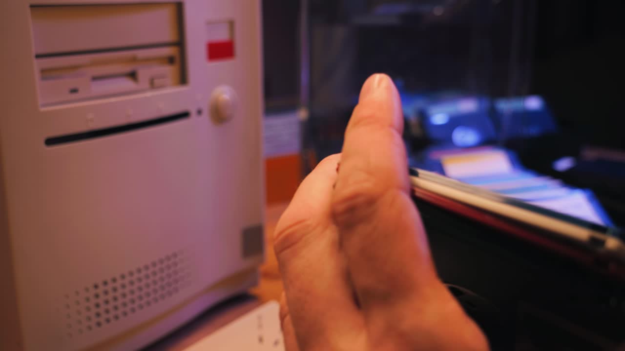 Using diskette for old computer. Music recorder, playing retro computer games. Vintage device for office, obsolete technology. . High quality 4k footage