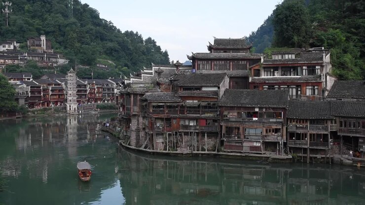 Fenghuang Ancient Town in Hunan Province, China, is a famous historic town known for its traditional Chinese architecture, stilt houses, cobblestone streets, and scenic riverside views