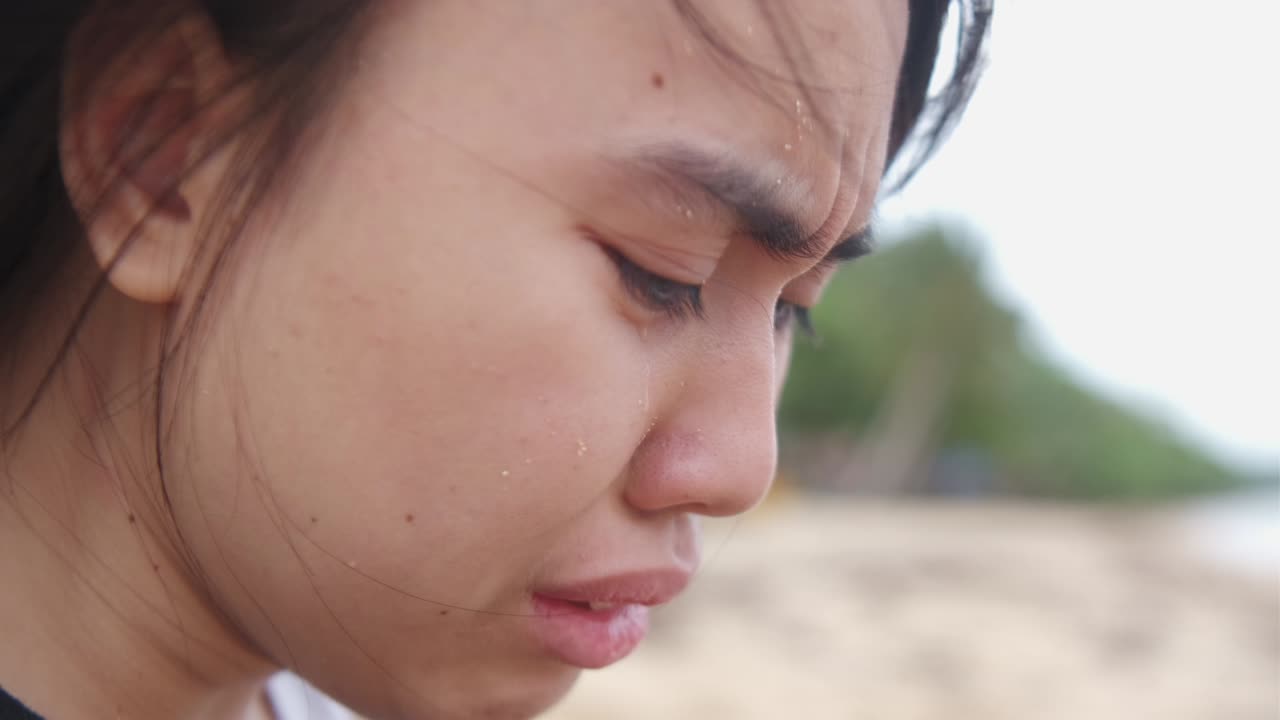 A Young Woman’s Face, Marked by Tears, Reflects Her Struggle With Depression and Mental Health Issues - Close Up
