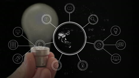 holding light bulb, hand with technology icons and earth animation