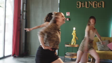 group of women dancing in a cafe