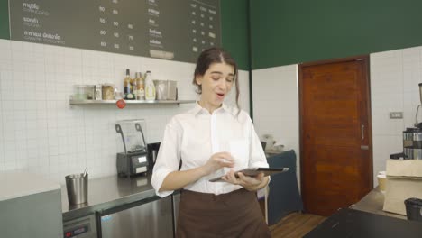 portrait of middle east woman barista people in apron selling products online via live e commerce live or conference on social media, cafe restaurant cashier. waitress in coffee shop. people lifestyle